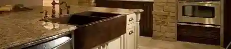 White fireclay apron-front farmhouse sink